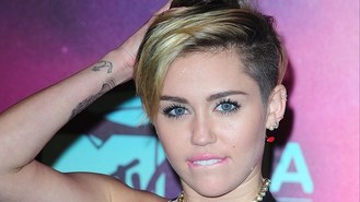 Miley faces raunchy antics backlash