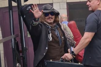 Johnny Depp blows kisses to screaming fans as he arrives to cheers for Jeff Beck gig in York