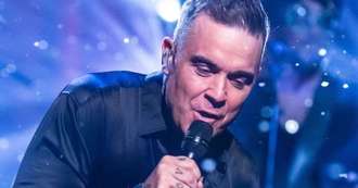 Robbie Williams admits he can't remember lyrics to his hit songs and needs autocue