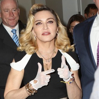Madonna wears diamond-studded grills to hide 'ugly' teeth
