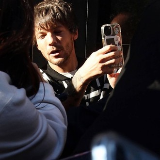 Louis Tomlinson updates fans reporting surgery on his broken arm 'went well'