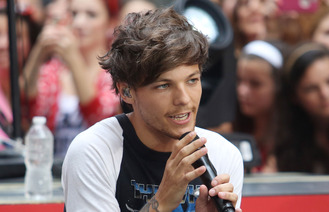 Louis Tomlinson 'makes plans to become a music boss'
