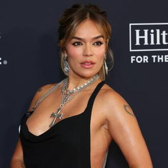 Bruno Mars Jokes About Winning Karol G Back